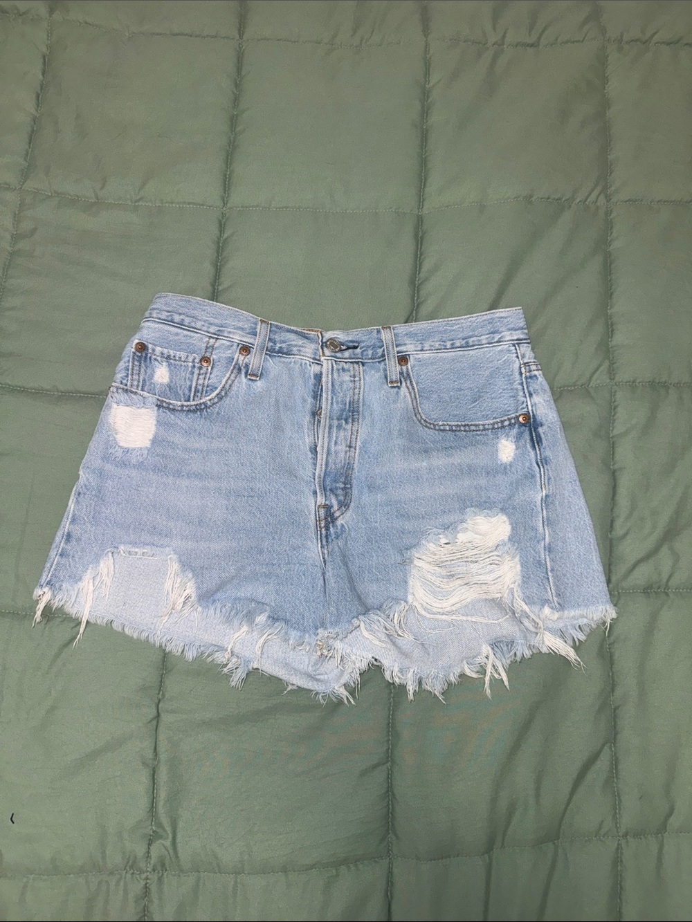 Levi’s 501 Light Wash Distressed Denim High-Waisted Cutoff Shorts